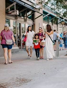 People walking down the sidewalk