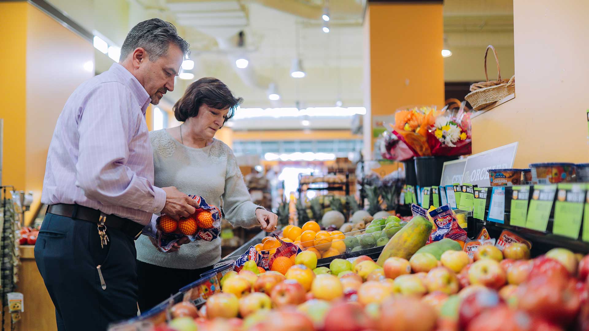 People looking at produce at Wohlner's Grocery