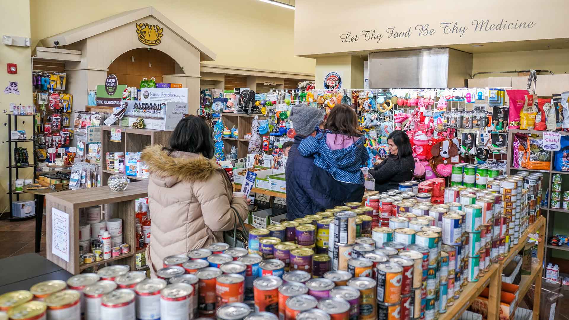 People shopping at Long Dog Fat Cat at Midtown Crossing