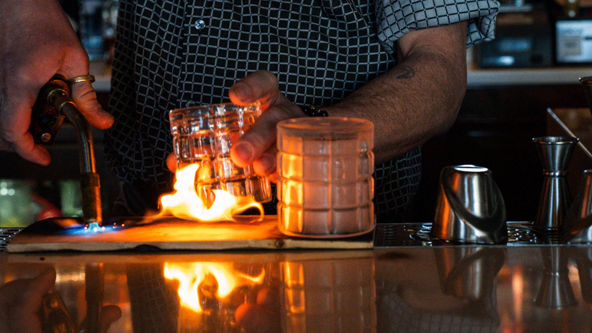 Bartender preparing handmade cocktail for happy hour at PROOF in Midtown Crossing - Omaha, Nebraska