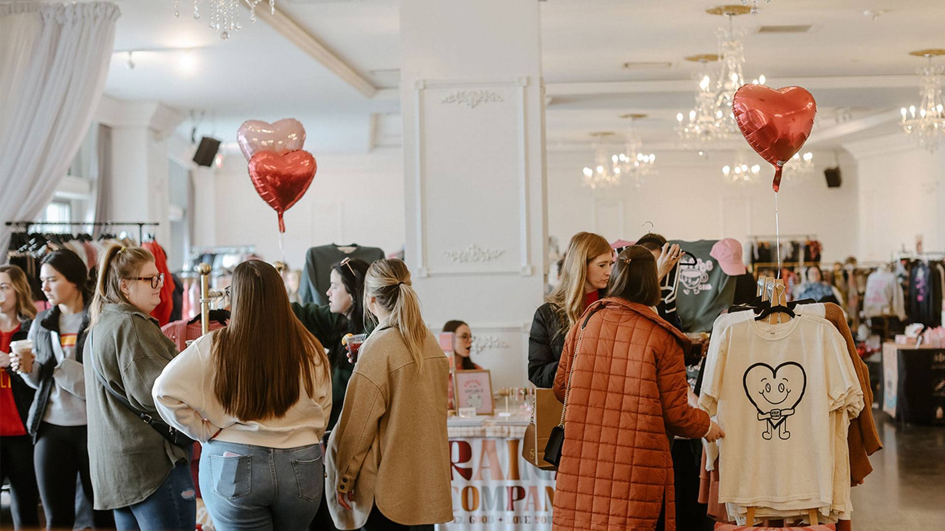 People shopping at Cupids Market inside Empire Room Omaha at Midtown Crossing