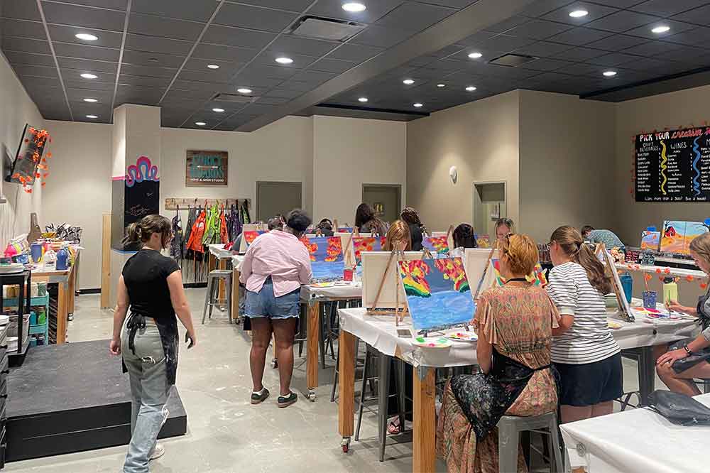 People painting at Corky Canvas