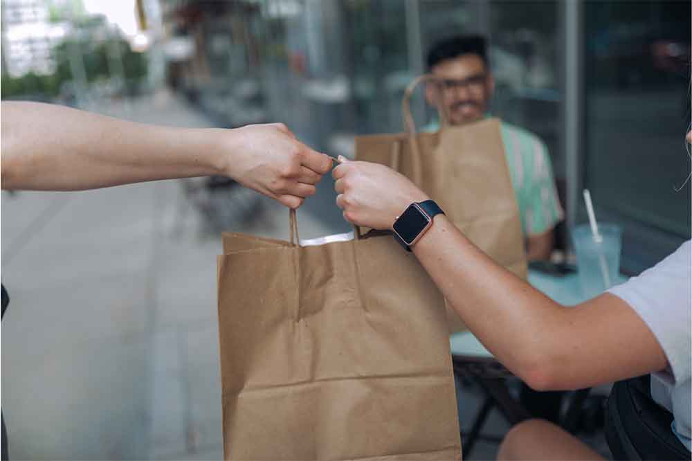 People using shops and services at Midtown Crossing