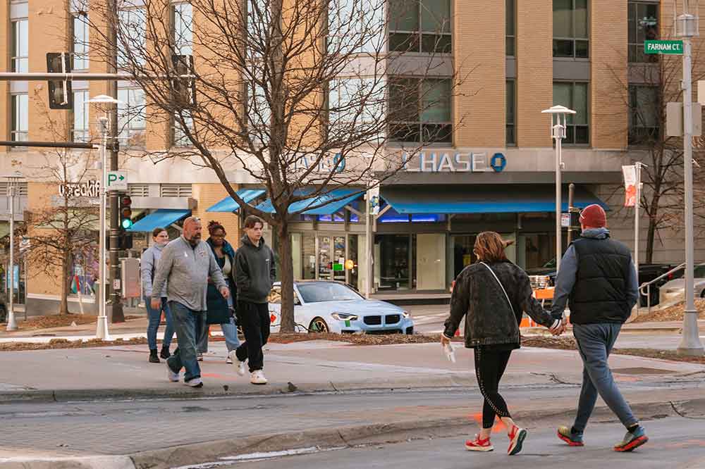 People walking on Farnam Street near Chase Bank